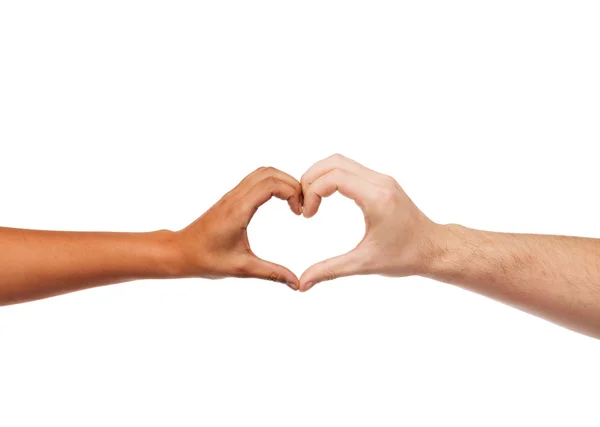 Woman and man hands showing heart shape — Stock Photo, Image