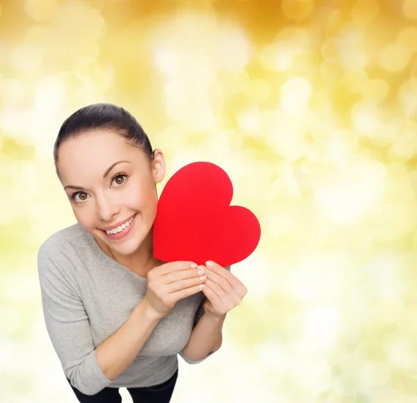 Smiling asian woman with red heart — Stock Photo, Image
