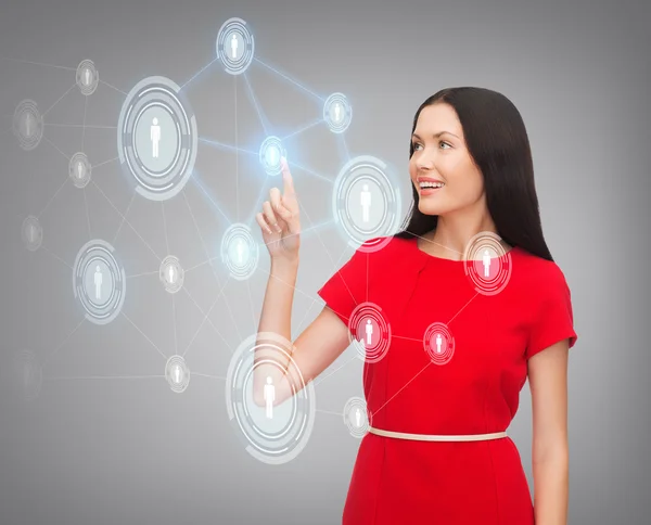 Mujer en vestido rojo y red de negocios — Foto de Stock