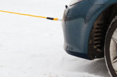 Closeup of towed car with towing rope clipart