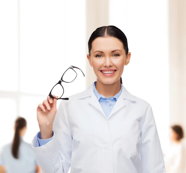 Smiling female doctor with eyeglasses — Stock Photo, Image