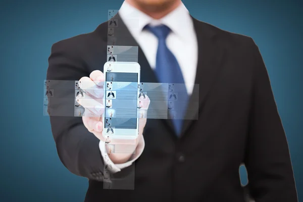 Businessman showing smartphone with news on screen — Stock Photo, Image