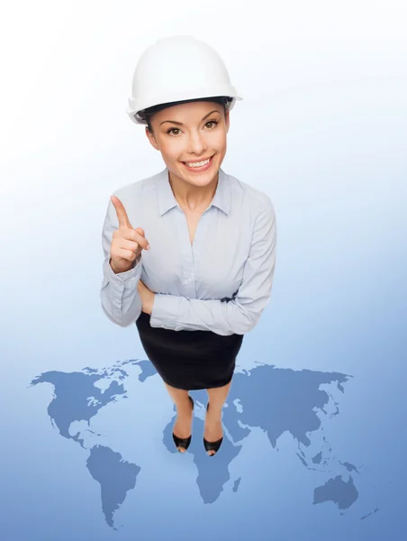 Businesswoman in white helmet with finger up — Stock Photo, Image