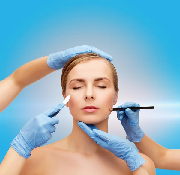 Woman face and beautician hands with pencil — Stock Photo, Image