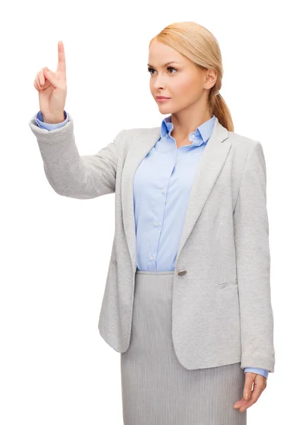 Smiling businesswoman working with virtual screen — Stock Photo, Image