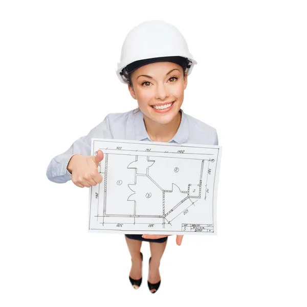 Businesswoman in helmet with blueprint — Stock Photo, Image
