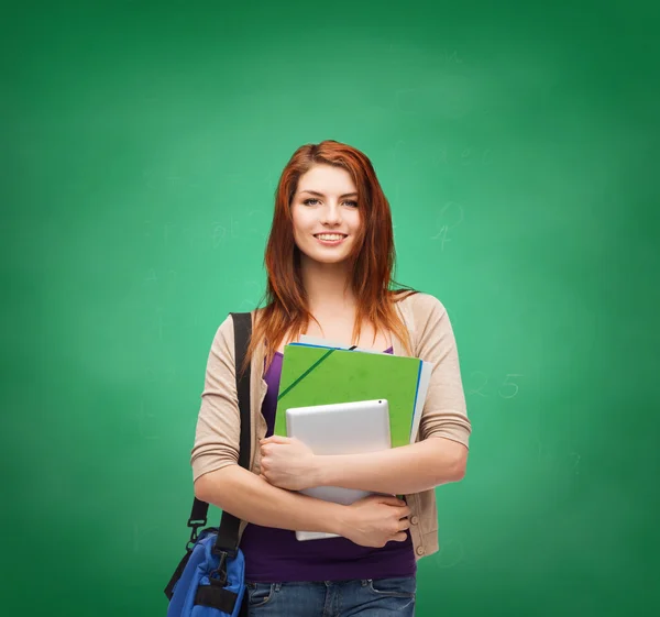 Studente sorridente con borsa, cartelle e tablet pc — Foto Stock