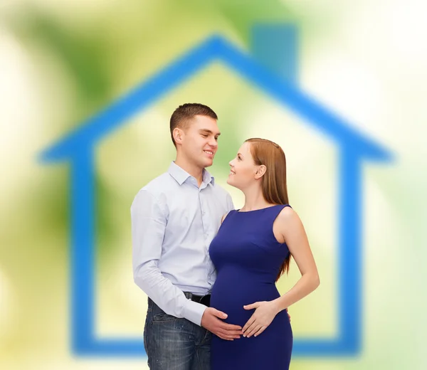 Happy young family expecting child — Stock Photo, Image