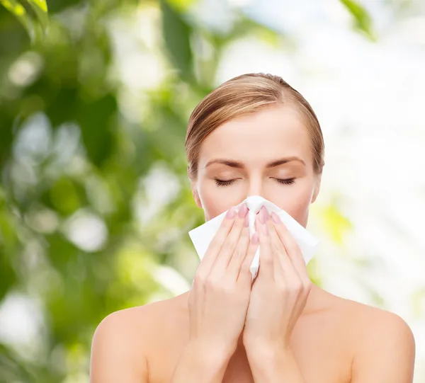 Beautiful woman with paper tissue — Stock Photo, Image