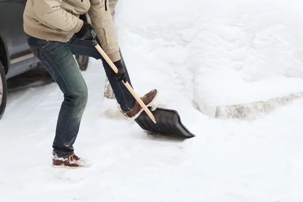 Closeup of man shoveling snow from driveway — Stock Photo, Image
