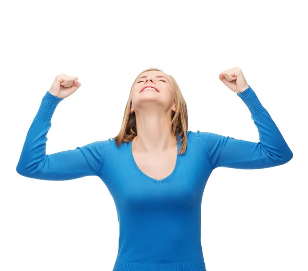 Smiling young woman with hands up — Stock Photo, Image