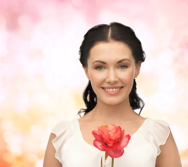 Young and beautiful woman with flower — Stock Photo, Image