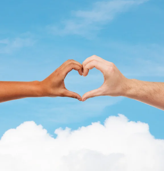 Woman and man hands showing heart shape — Stock Photo, Image