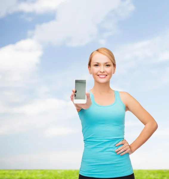 Sportliche Frau mit Smartphone — Stockfoto