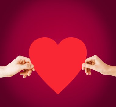 Couple hands holding red heart clipart
