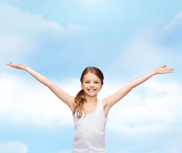 Smiling teenage girl with raised hands — Stock Photo, Image