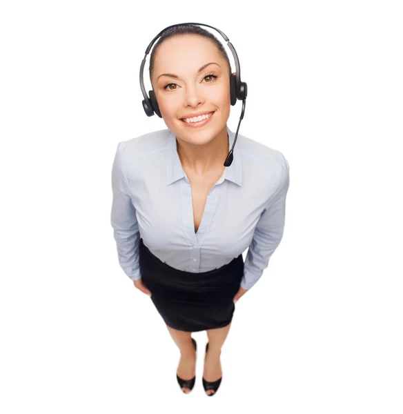Vänlig kvinnlig hjälptelefon operatör med hörlurar — Stockfoto
