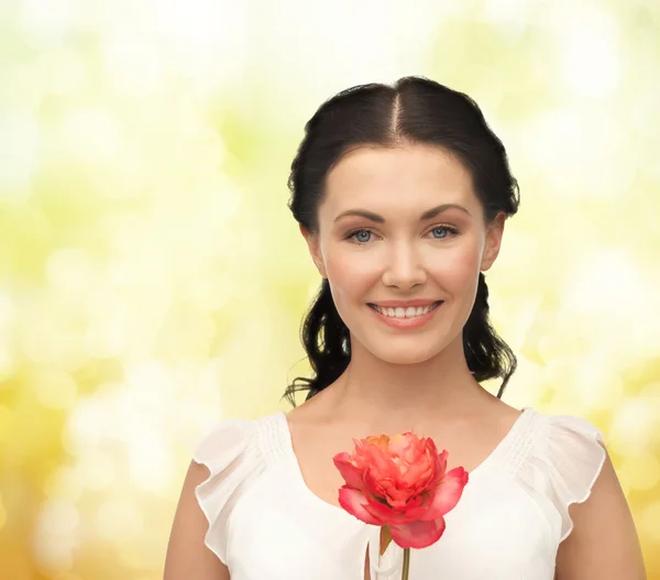 Young and beautiful woman with flower — Stock Photo, Image