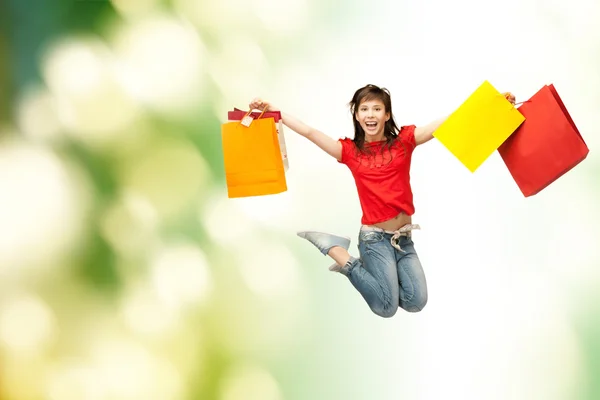 Podekscytowany dziewczyna z torby na zakupy — Zdjęcie stockowe