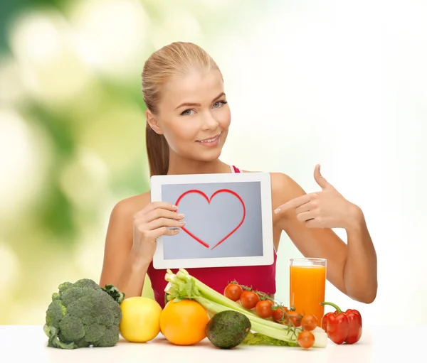 Femme aux fruits, légumes et tablettes pc — Photo