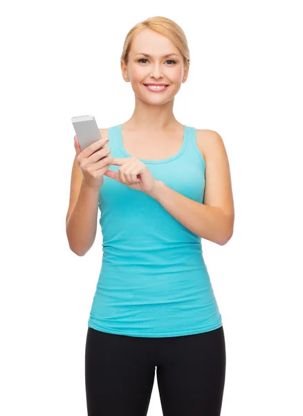 Sporty woman with smartphone — Stock Photo, Image
