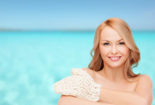 Smiling woman with exfoliation glove — Stock Photo, Image