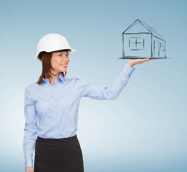 Young smiling businesswoman in white helmet — Stock Photo, Image