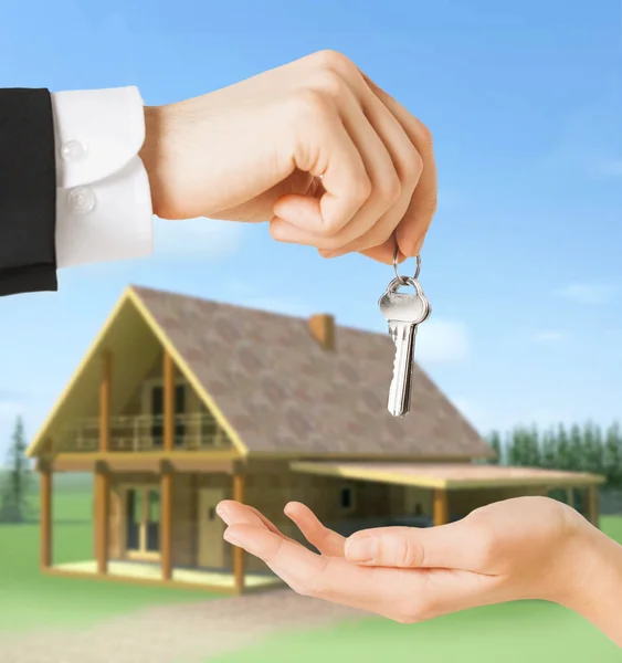 Close up of man and woman with house keys — Stock Photo, Image