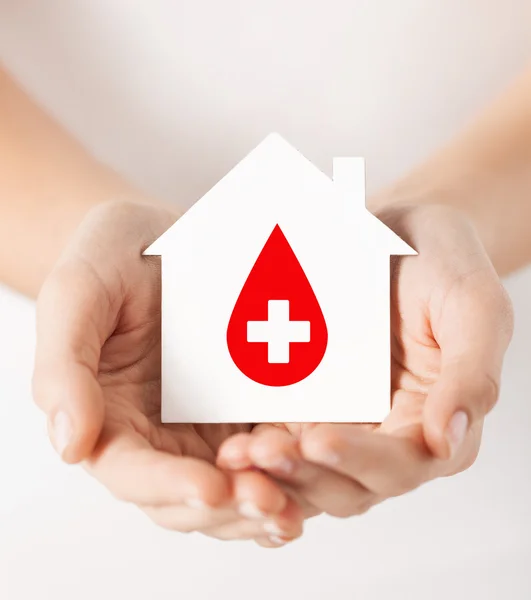 Hands holding house with donor sign — Stock Photo, Image