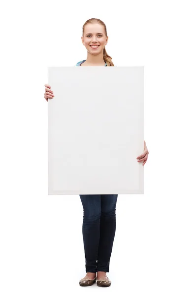 Smiling young woman with white blank board — Stock Photo, Image