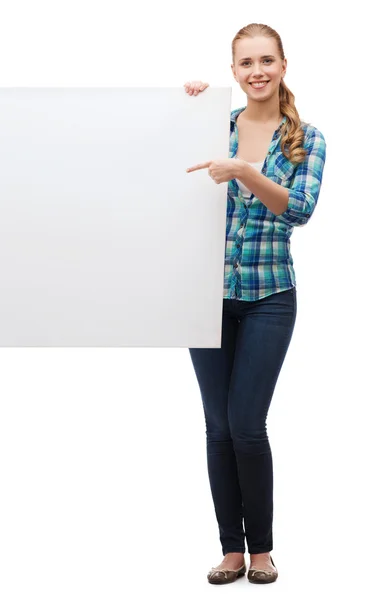 Smiling young woman with white blank board — Stock Photo, Image