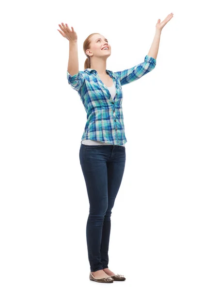 Smiling young woman waving hands — Stock Photo, Image