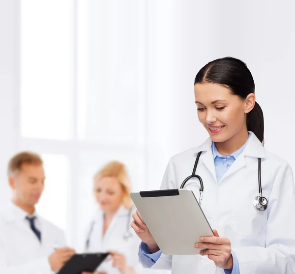 Female doctor with stethoscope and tablet pc — Stock Photo, Image