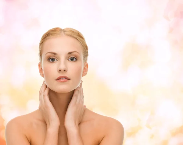 Beautiful woman touching her face skin — Stock Photo, Image