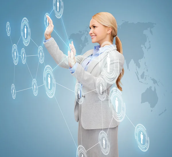 Smiling businesswoman working with virtual screen — Stock Photo, Image