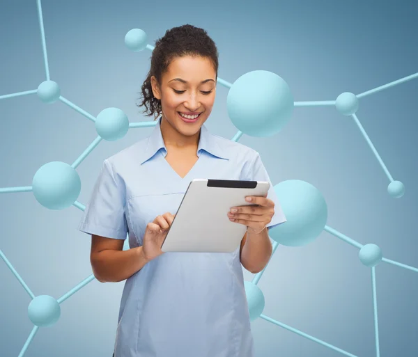 Smiling black doctor or nurse with tablet pc — Stock Photo, Image