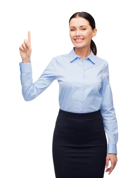 Lächelnde Frau mit erhobenem Finger — Stockfoto