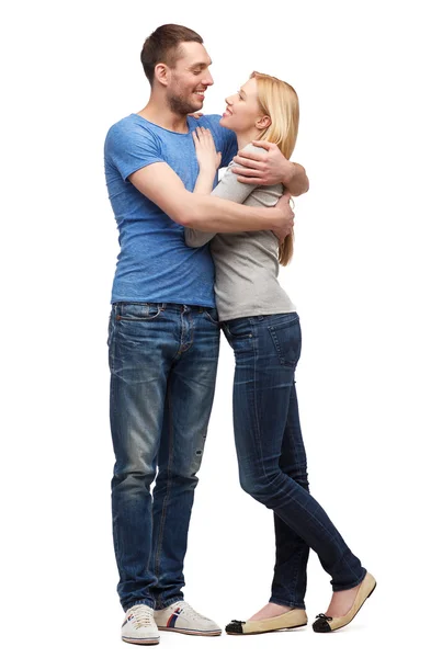 Smiling couple hugging and looking at each other — Stock Photo, Image