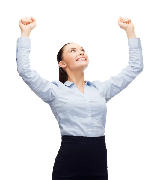 Smiling businesswoman with hands up — Stock Photo, Image