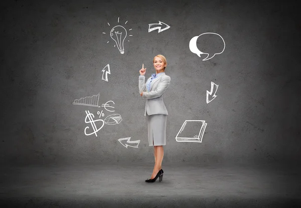 Attractive young businesswoman with her finger up — Stock Photo, Image