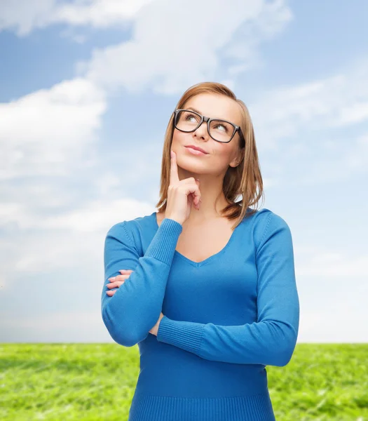 Happy woman in black eyeglasses dreaming — Stock Photo, Image