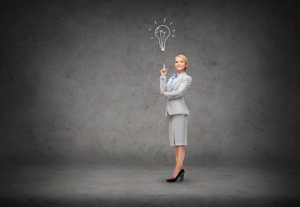 Attractive young businesswoman with her finger up — Stock Photo, Image