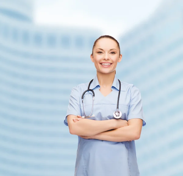 Smiling female doctor or nurse with stethoscope — Stock Photo, Image