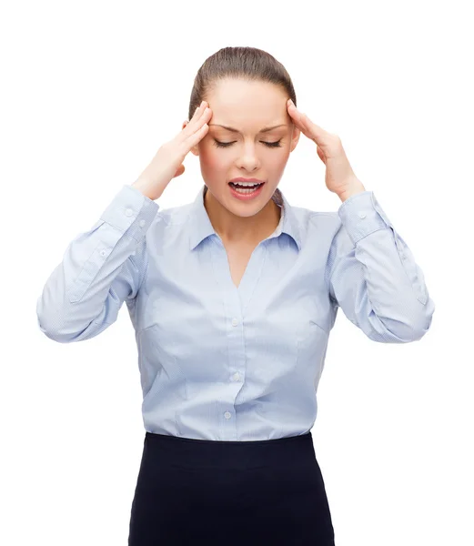 Verärgerte Geschäftsfrau hat Kopfschmerzen — Stockfoto