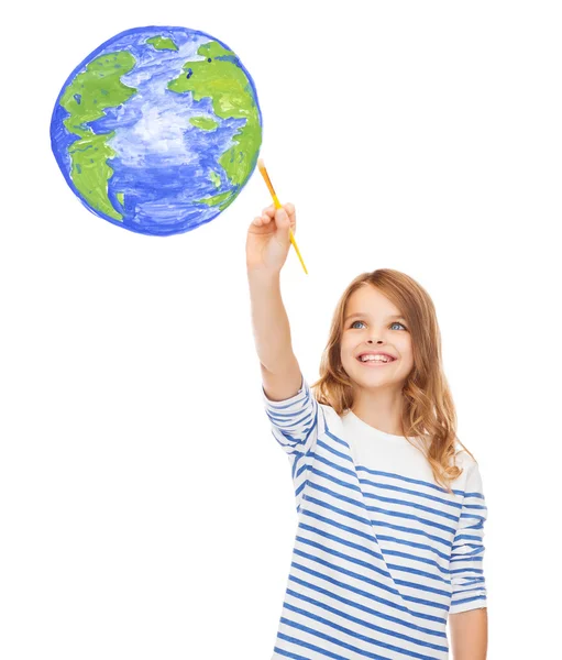 Cute little girl drawing with brush planet earth — Stock Photo, Image