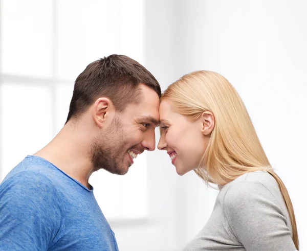 Smiling couple looking at each other — Stock Photo, Image