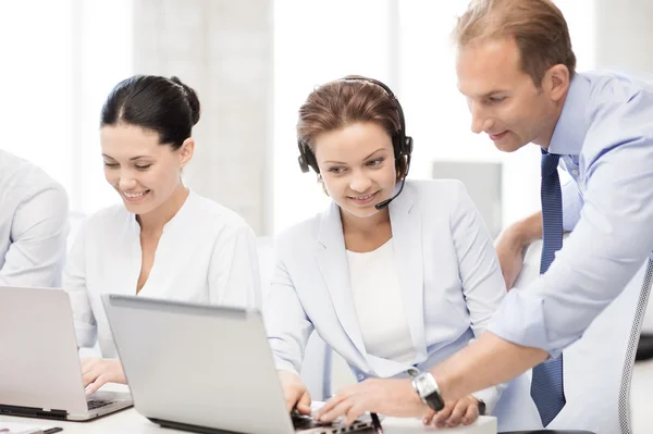Group of people working in call center