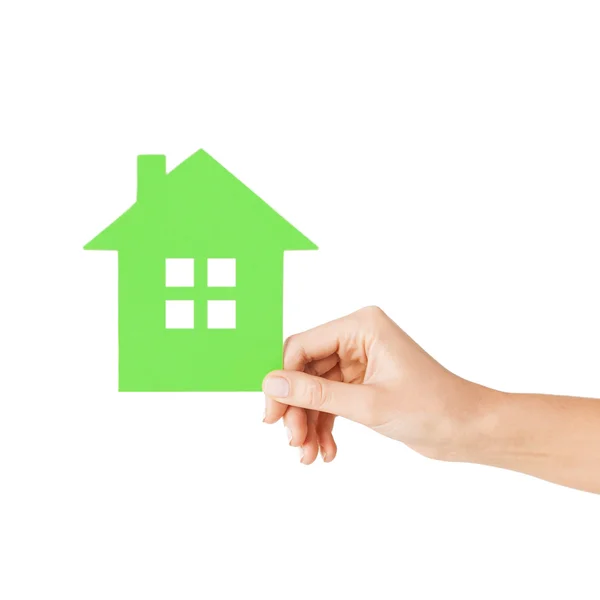 Hand holding green paper house — Stock Photo, Image