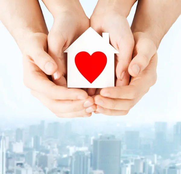 Couple hands holding white paper house — Stock Photo, Image