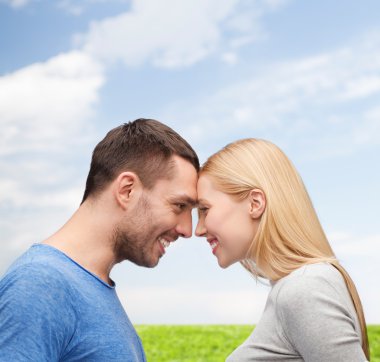 Smiling couple looking at each other clipart